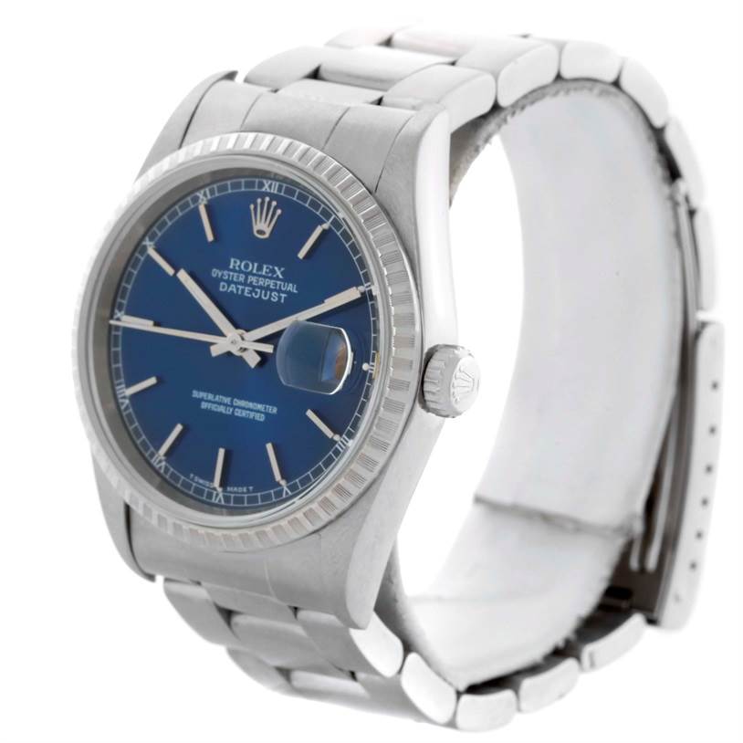 The Rolex Datejust 16220 Men
s Stainless Steel Blue Dial 16220 Men
s Stainless Steel Blue Dial watch is shown at a slight front-side angle, displaying its face, bezel, crown, and bracelet.
