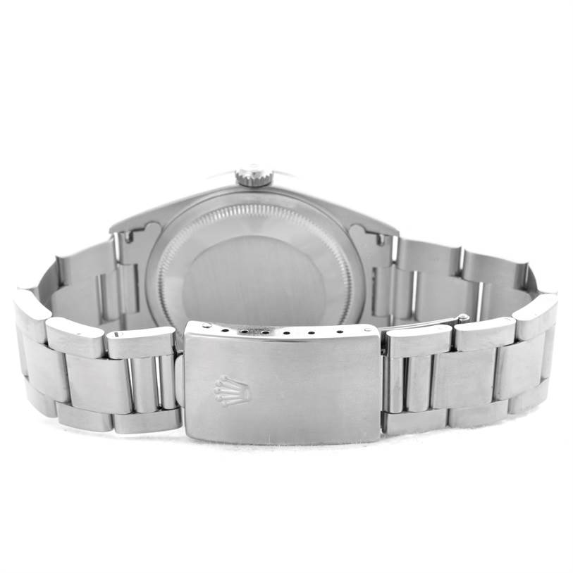 The image displays the back side and clasp of a Rolex Datejust 16220 Men
s Stainless Steel Blue Dial 16220 Men
s Stainless Steel Blue Dial watch, showcasing its stainless steel bracelet and closed case back.