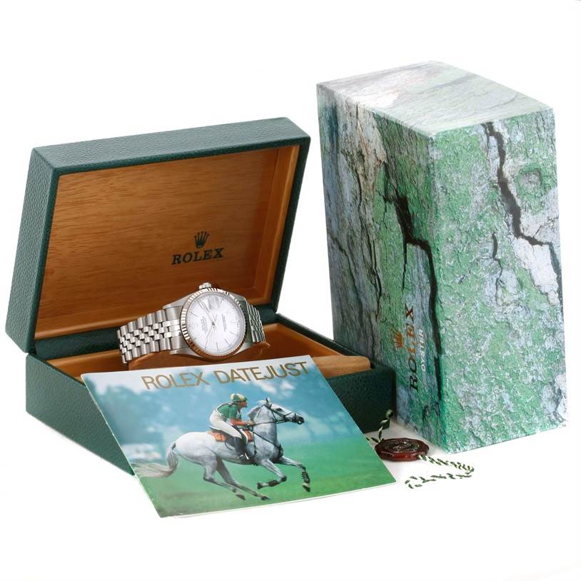 The image shows a Rolex Datejust 16234 Men's Stainless Steel White Dial 16234 Men's Stainless Steel White Dial watch inside its open box, accompanied by a booklet and outer packaging.