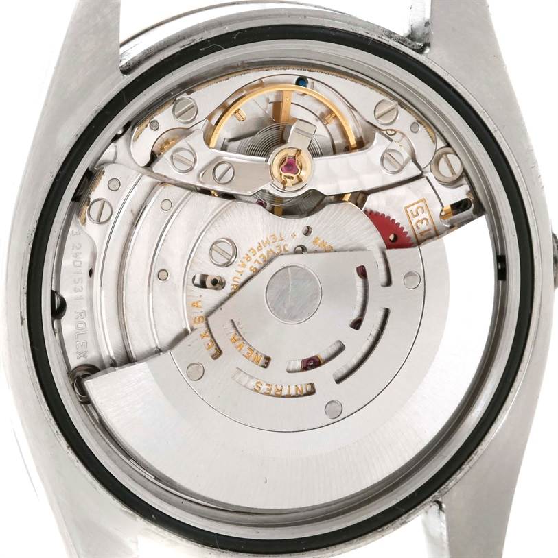 This image shows a close-up of the Rolex Datejust 116234 Men's Stainless Steel Silver Dial 116234 Men's Stainless Steel Silver Dial model's automatic movement mechanism from the back.