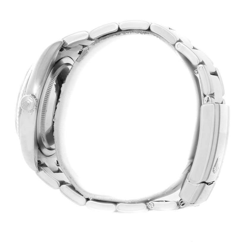 This side view of the Rolex Datejust 116234 Men's Stainless Steel Silver Dial 116234 Men's Stainless Steel Silver Dial watch shows the profile of the case, crown, and metal bracelet.