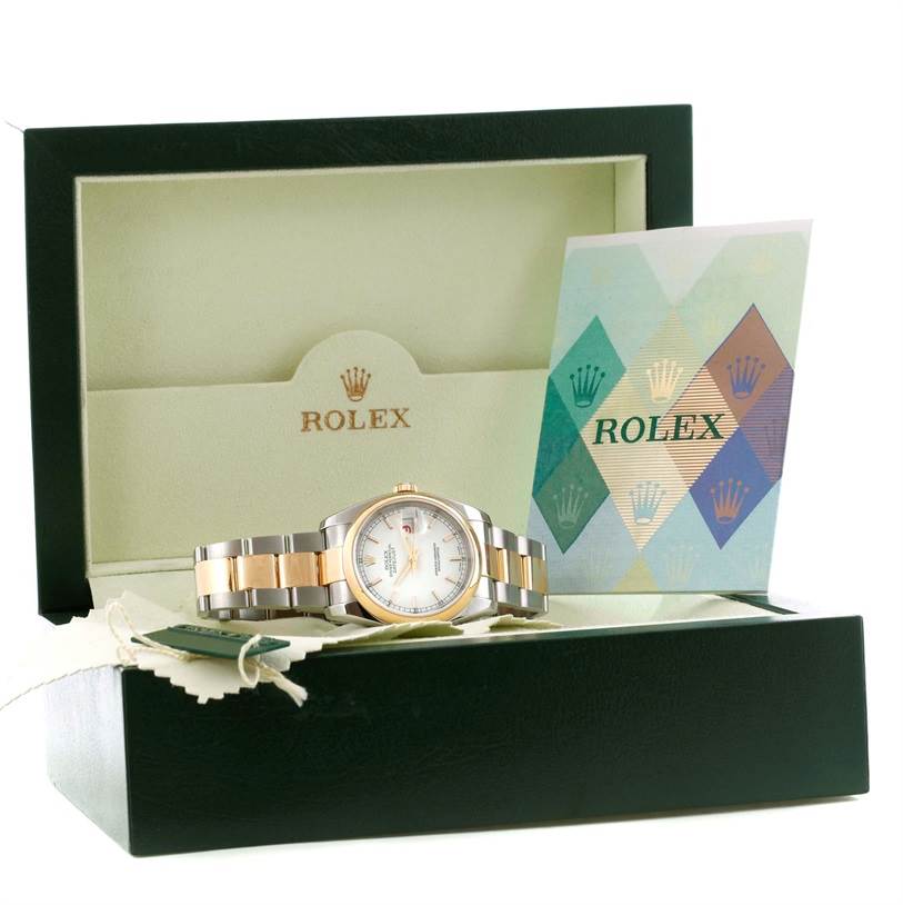 The image shows a Rolex Datejust 116203 Men
s Stainless Steel White Dial 116203 Men
s Stainless Steel White Dial watch positioned inside an open green box with its cards and tags.