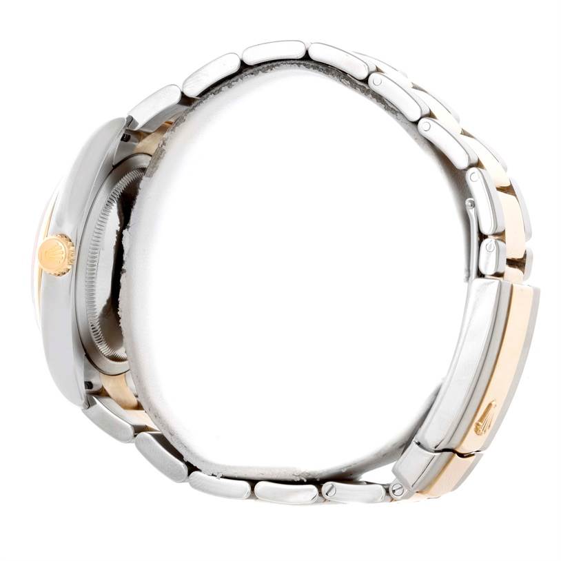 The side view of the Rolex Datejust 116203 Men
s Stainless Steel White Dial 116203 Men
s Stainless Steel White Dial watch shows the crown and part of the bracelet clearly.