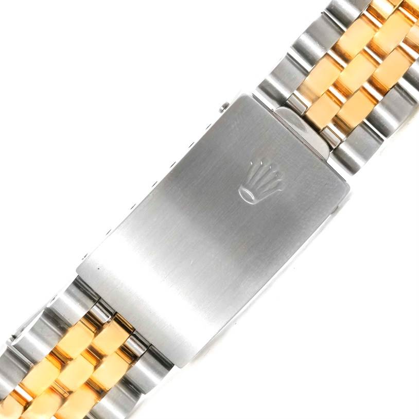 The image shows a close-up of the clasp and bracelet of a Rolex Datejust 16233 Men's Steel and Gold (two tone) Beige Dial 16233 Men's Steel and Gold (two tone) Beige Dial watch, highlighting its two-tone metal finish.