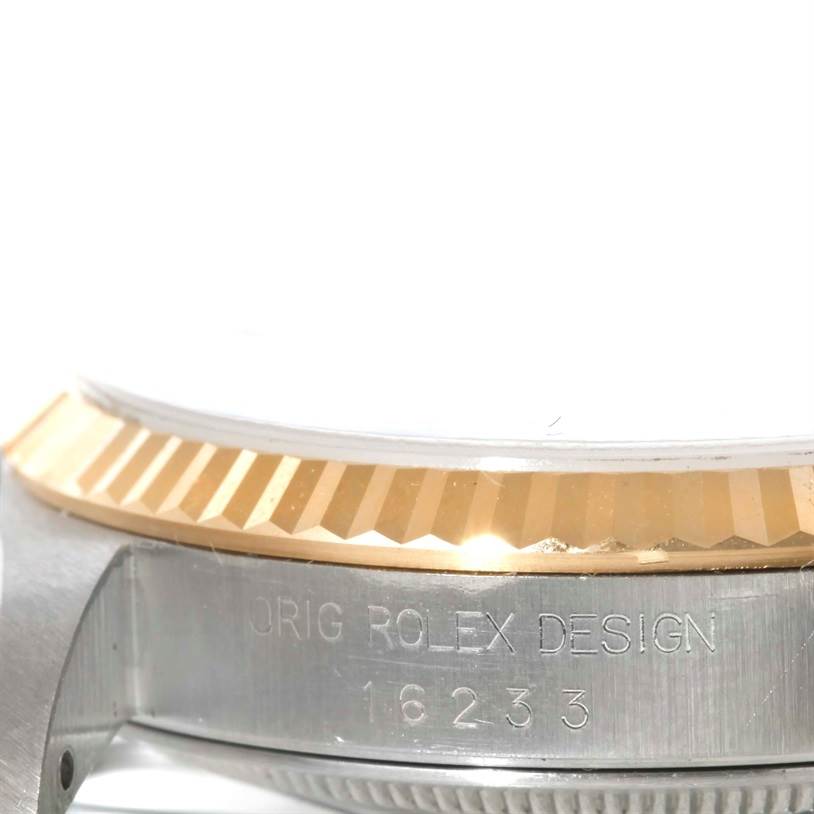The image shows a close-up of the side view of a Rolex Datejust 16233 Men's Steel and Gold (two tone) Beige Dial 16233 Men's Steel and Gold (two tone) Beige Dial watch, focusing on the bezel and case, displaying model number 16233.