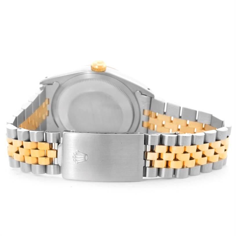 This image shows the back of a Rolex Datejust 16233 Men's Steel and Gold (two tone) Beige Dial 16233 Men's Steel and Gold (two tone) Beige Dial watch, highlighting its jubilee bracelet and clasp.