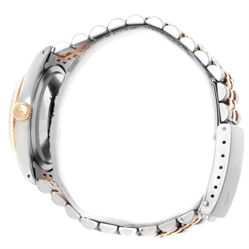 This image of a Rolex Datejust 16233 Men's Steel and Gold (two tone) Beige Dial 16233 Men's Steel and Gold (two tone) Beige Dial watch shows a side view of the case and the full bracelet, including the clasp.