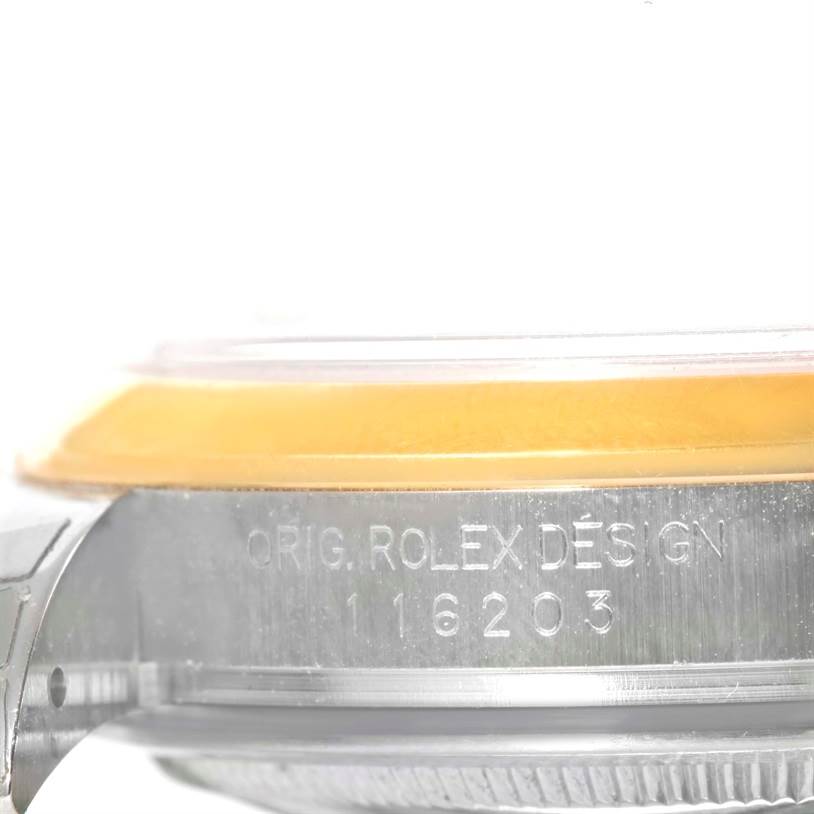 This close-up image shows the side view of the case of a Rolex Datejust 116203 Men's Stainless Steel Grey Dial 116203 Men's Stainless Steel Grey Dial, highlighting the original design engraving and model number.
