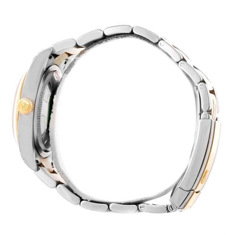 This side view of the Rolex Datejust 116203 Men's Stainless Steel Grey Dial 116203 Men's Stainless Steel Grey Dial watch shows the crown, casing, and part of the bracelet.