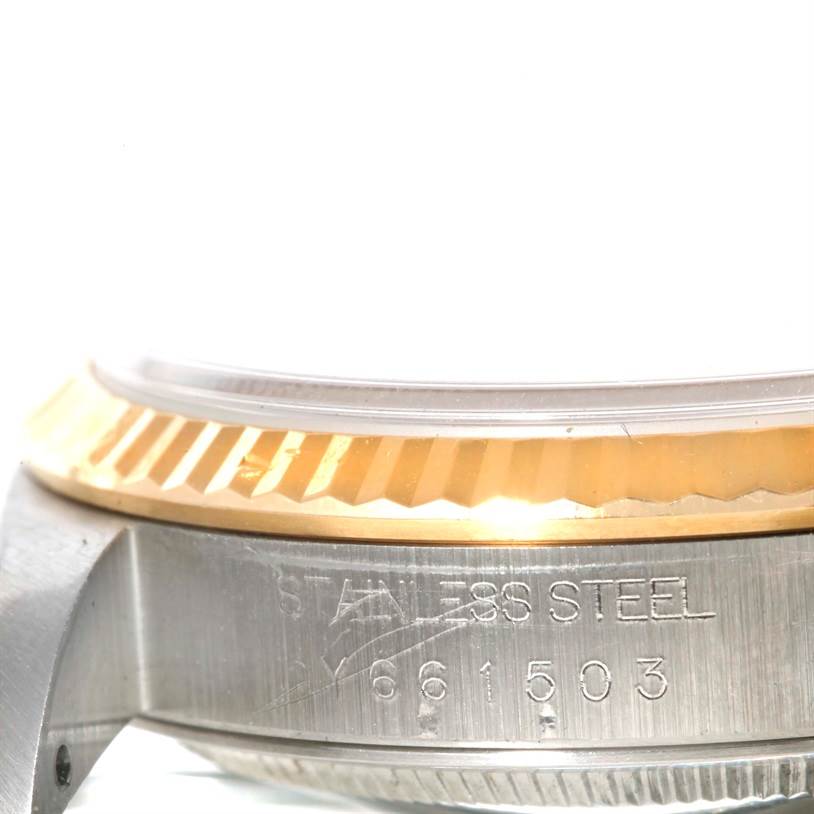 The image shows a close-up side view of the case and bezel of a Rolex Datejust 16233 Men's Steel and Gold (two tone) Silver Dial 16233 Men's Steel and Gold (two tone) Silver Dial watch.