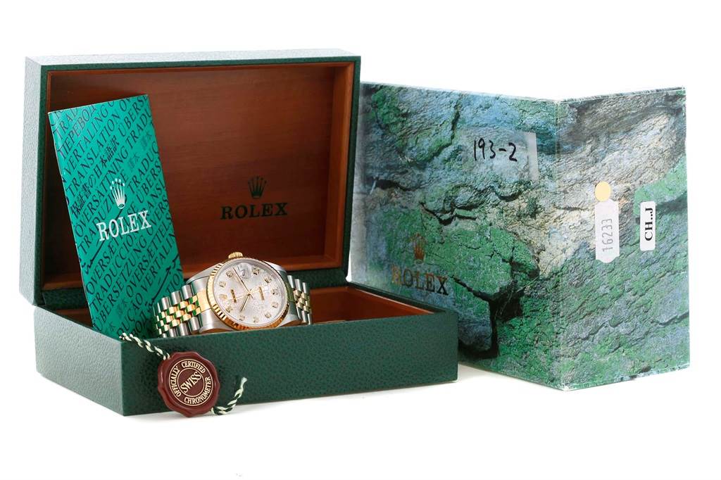 The Rolex Datejust 16233 Men's Steel and Gold (two tone) Silver Dial 16233 Men's Steel and Gold (two tone) Silver Dial watch is shown in its open box at a front angle, along with warranty card and outer box.