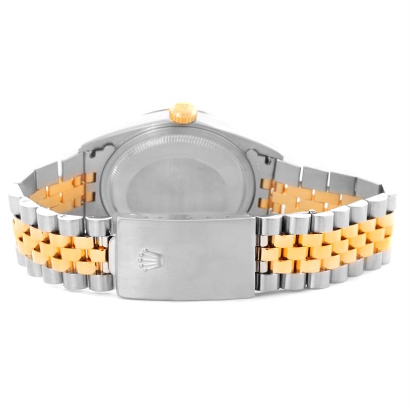 This image shows the back case and jubilee bracelet clasp of a Rolex Datejust 16233 Men's Steel and Gold (two tone) Silver Dial 16233 Men's Steel and Gold (two tone) Silver Dial watch.