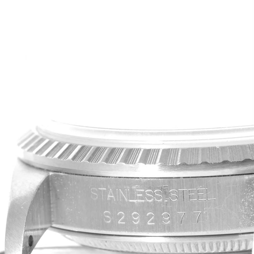 This image shows a close-up angle of the case side, including the bezel and part of the casing of a Rolex Datejust 16220 Men
s Stainless Steel White Dial 16220 Men
s Stainless Steel White Dial watch.