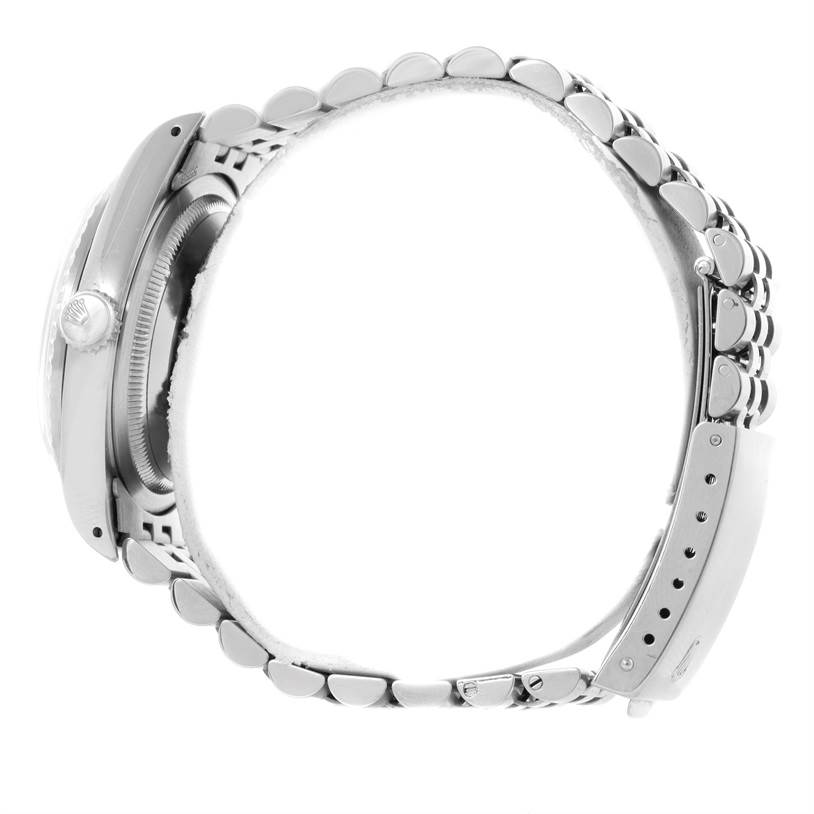 The image shows a side view of a Rolex Datejust 16220 Men
s Stainless Steel White Dial 16220 Men
s Stainless Steel White Dial watch, highlighting the case, crown, and bracelet.