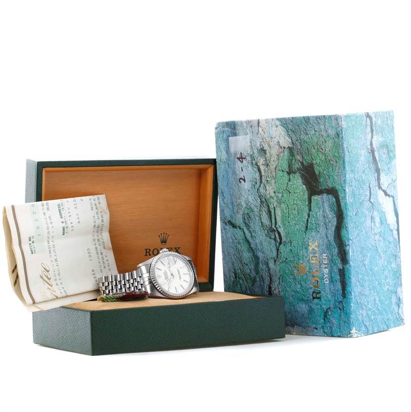 The image shows a Rolex Datejust 16220 Men
s Stainless Steel White Dial 16220 Men
s Stainless Steel White Dial watch in its box, with documents and an outer Rolex Oyster box displayed.