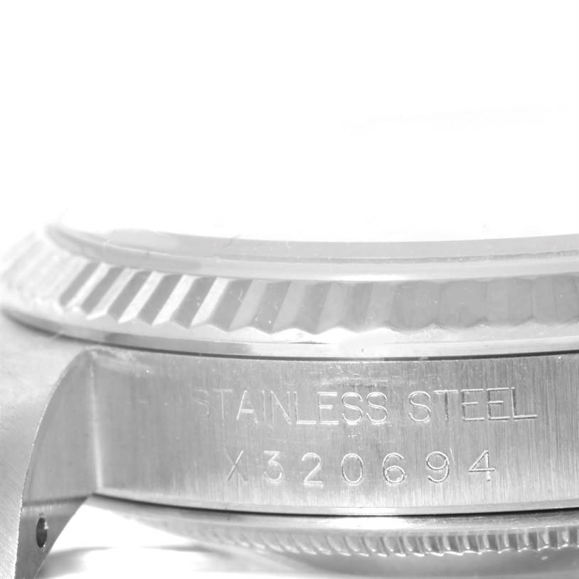 This image shows a close-up view of the bezel and side engraving of a stainless steel Rolex Datejust 16234 Men
s Stainless Steel Black Dial 16234 Men
s Stainless Steel Black Dial watch.
