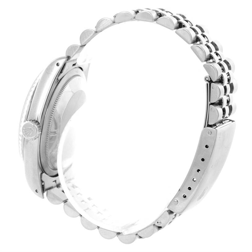 The image shows a side view of a Rolex Datejust 16234 Men
s Stainless Steel Black Dial 16234 Men
s Stainless Steel Black Dial watch, highlighting the case, crown, and metal bracelet.