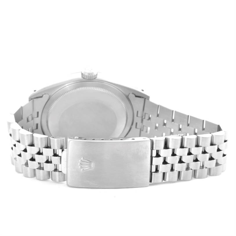 This image shows the backside of the Rolex Datejust 16234 Men
s Stainless Steel Black Dial 16234 Men
s Stainless Steel Black Dial watch and its Jubilee bracelet clasp.