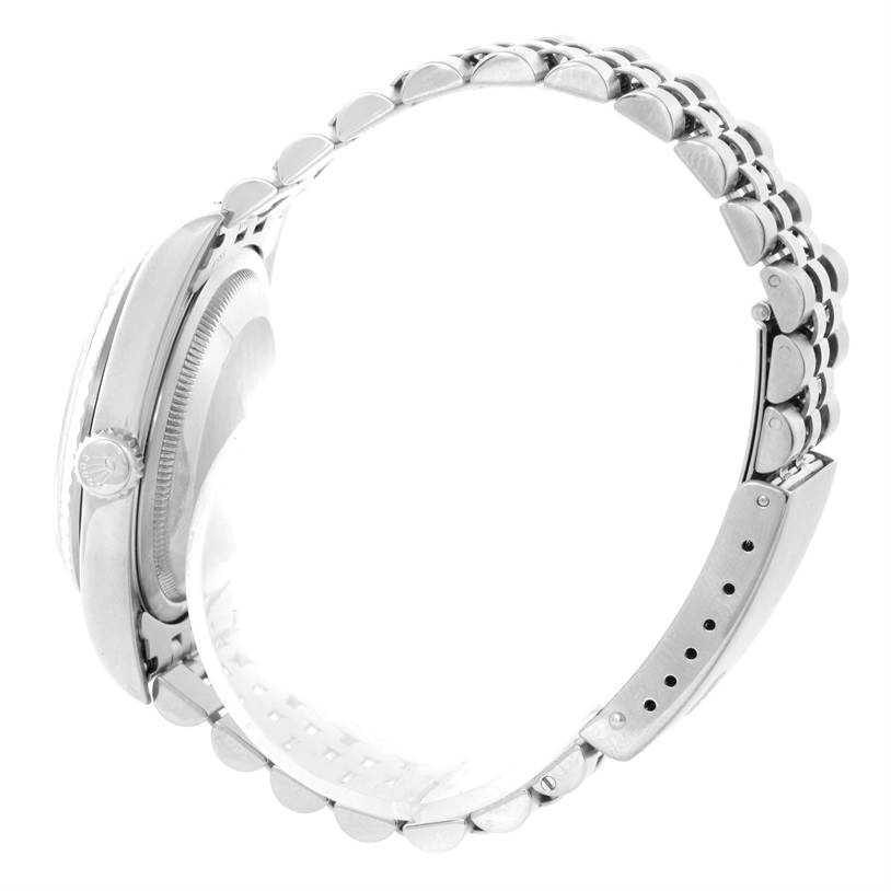 The image shows the side profile of a Rolex Datejust 16234 Men's Stainless Steel White Dial 16234 Men's Stainless Steel White Dial watch, highlighting the case, crown, and bracelet.