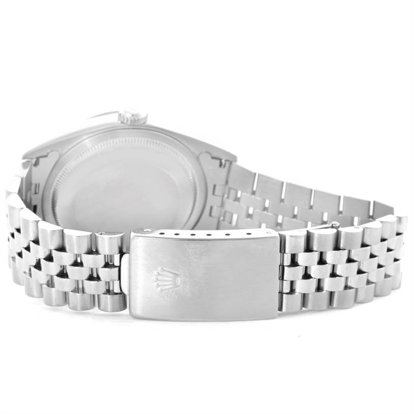 The image shows the Rolex Datejust 16234 Men's Stainless Steel White Dial 16234 Men's Stainless Steel White Dial watch from the back, focusing on its case back and Jubilee bracelet clasp.