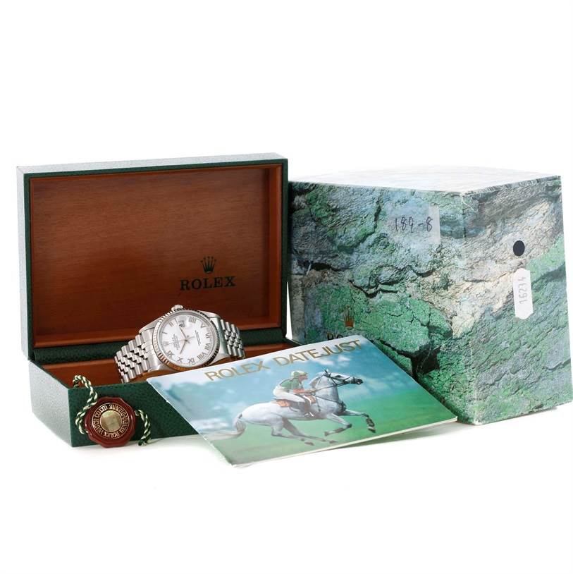 This image shows a Rolex Datejust 16234 Men's Stainless Steel White Dial 16234 Men's Stainless Steel White Dial watch in its box with an outer box, authenticity tag, and manual.