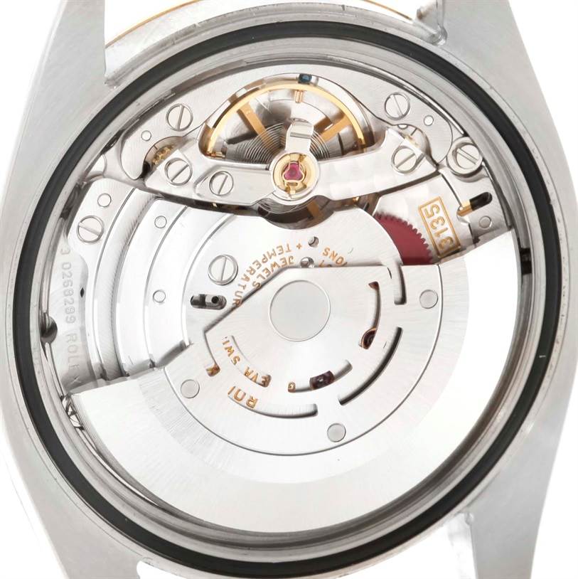 The image shows the back view of the Rolex Datejust 116203 Men's Stainless Steel Black Dial 116203 Men's Stainless Steel Black Dial watch, highlighting its internal mechanical movement.