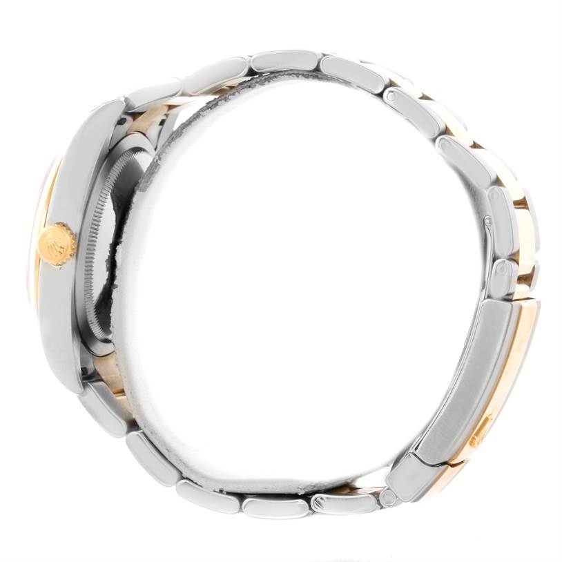 This side view of the Rolex Datejust 116203 Men's Stainless Steel Black Dial 116203 Men's Stainless Steel Black Dial watch showcases its gold crown, two-tone bracelet, and case profile.