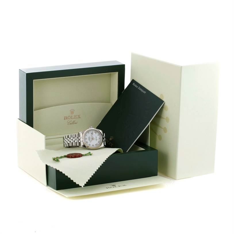 The image shows a Rolex Datejust 116234 Men's Stainless Steel White Dial 116234 Men's Stainless Steel White Dial watch at an angle, along with its open box, documentation, and a cleaning cloth.