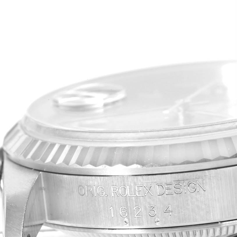 This image shows a side view of the Rolex Datejust 16234 Men
s Stainless Steel Pink Dial 16234 Men
s Stainless Steel Pink Dial watch case, highlighting the engraving and the fluted bezel.