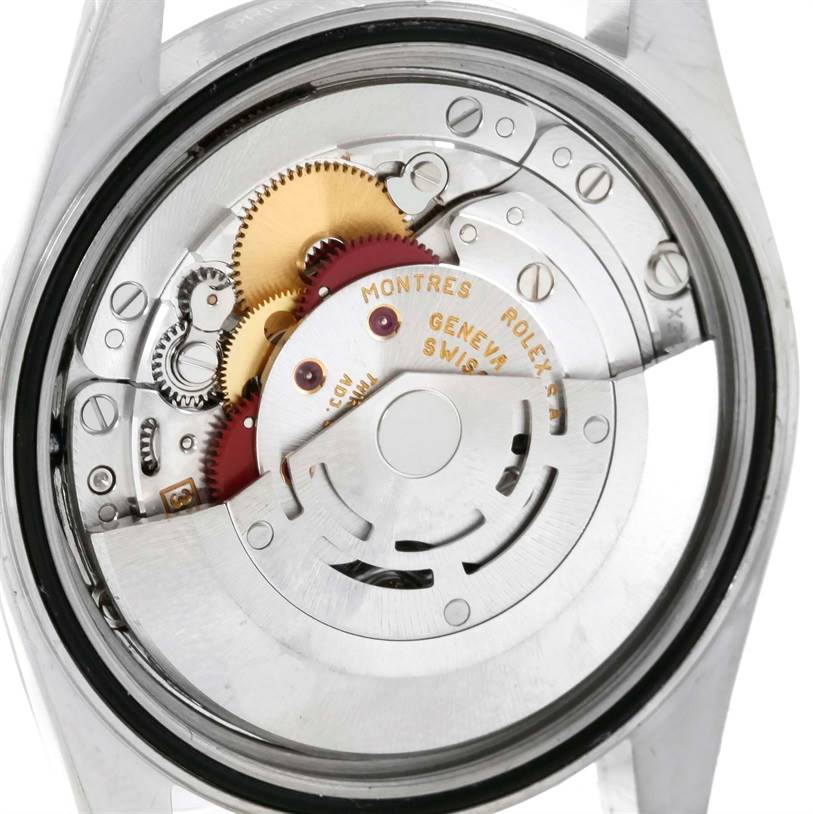 The image shows the back view of the Rolex Datejust 16234 Men
s Stainless Steel Pink Dial 16234 Men
s Stainless Steel Pink Dial watch, focusing on its internal mechanical movement.