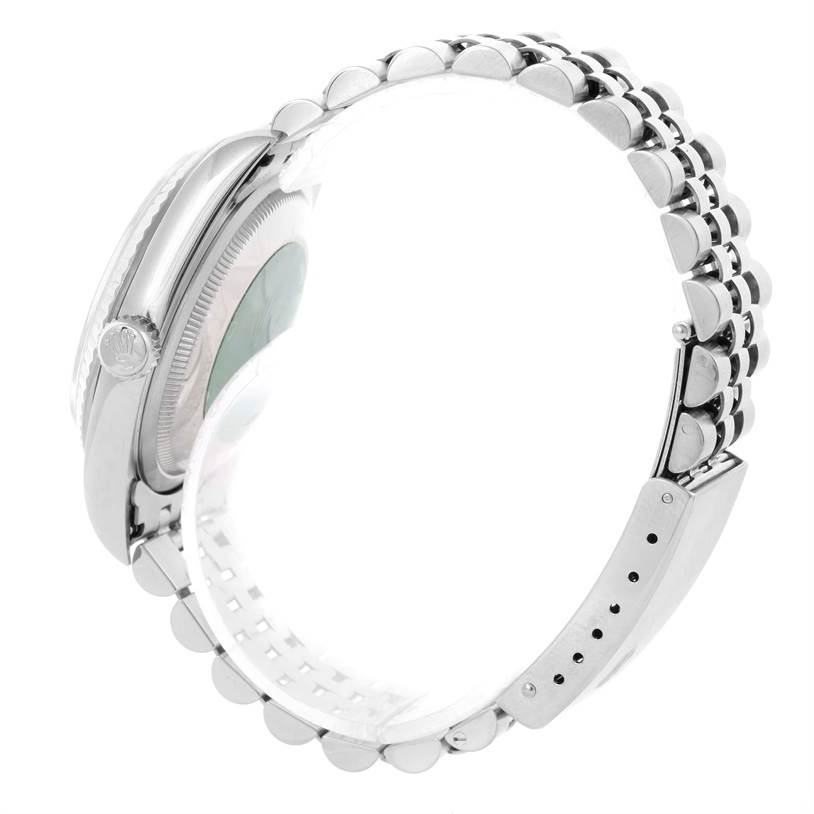 The image shows a side view of a Rolex Datejust 16234 Men
s Stainless Steel Pink Dial 16234 Men
s Stainless Steel Pink Dial watch, displaying its crown, case, and part of the band.