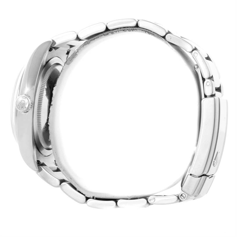 The image shows a side view of a Rolex Datejust 116200 Men's Stainless Steel Silver Dial 116200 Men's Stainless Steel Silver Dial watch focusing on the crown and bracelet.