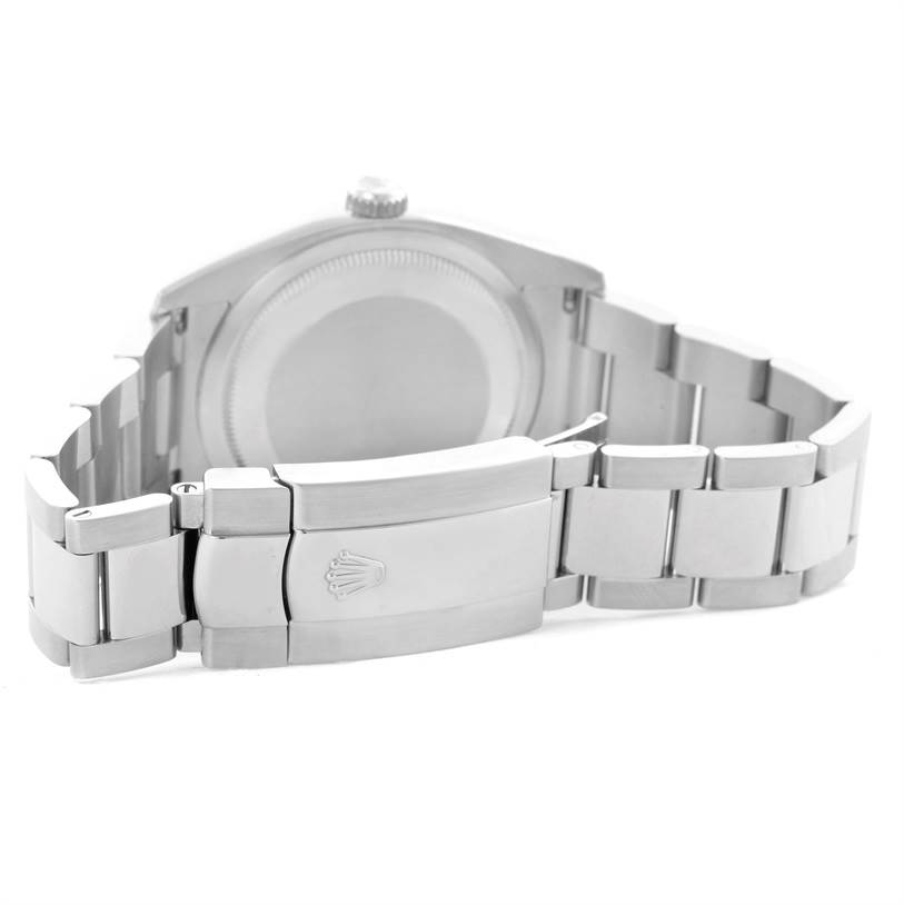 The image shows the back view of the Rolex Datejust 116200 Men's Stainless Steel Silver Dial 116200 Men's Stainless Steel Silver Dial watch, highlighting the rear case and the clasp of the metal bracelet.