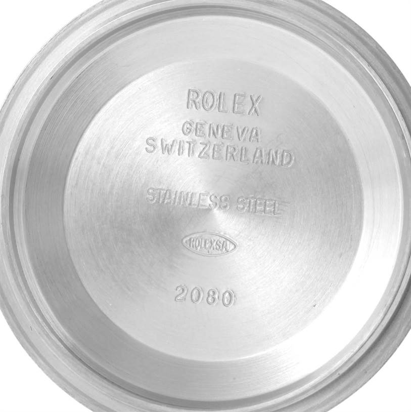 This is the inside case back of a Rolex Datejust 116244 Men's Stainless Steel Silver Dial 116244 Men's Stainless Steel Silver Dial, showing engraved text indicating its make and material.