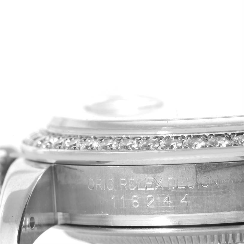 A close-up side view of a Rolex Datejust 116244 Men's Stainless Steel Silver Dial 116244 Men's Stainless Steel Silver Dial watch showing its diamond-set bezel and engraved case details.