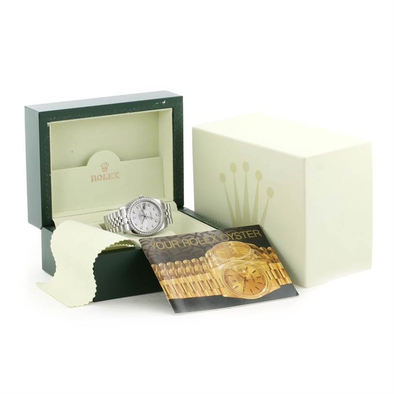 The Rolex Datejust 116244 Men's Stainless Steel Silver Dial 116244 Men's Stainless Steel Silver Dial watch is shown at an angle in its open box with additional packaging and a booklet nearby.