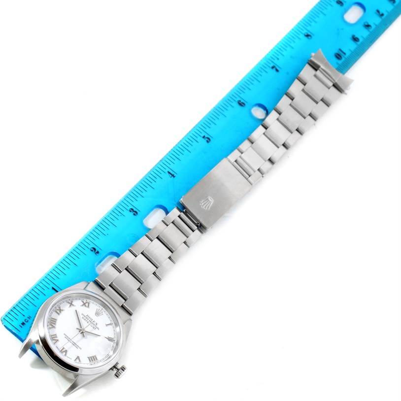 The image shows the face, bracelet, and clasp of a Rolex Datejust 16200 Men's Stainless Steel White Dial 16200 Men's Stainless Steel White Dial watch, laid next to a blue ruler.