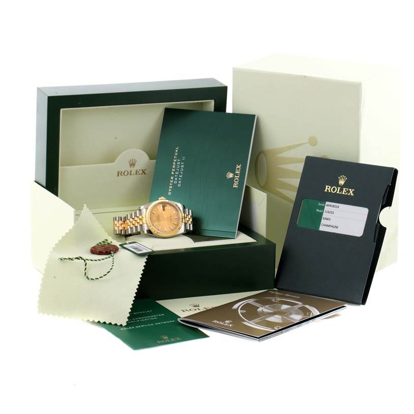 The image shows a Rolex Datejust 116233 Men's Stainless Steel Champagne Dial 116233 Men's Stainless Steel Champagne Dial watch with its box, warranty card, booklets, and a polishing cloth.