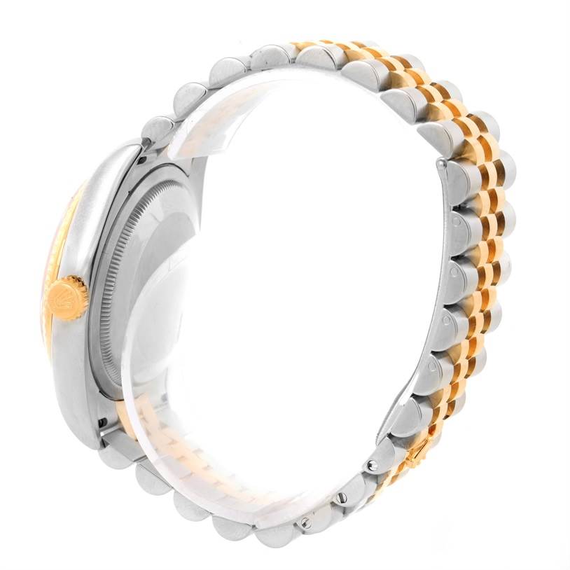 The image shows a side view of a Rolex Datejust 116233 Men's Stainless Steel Champagne Dial 116233 Men's Stainless Steel Champagne Dial watch, highlighting its crown, case, and two-tone bracelet.