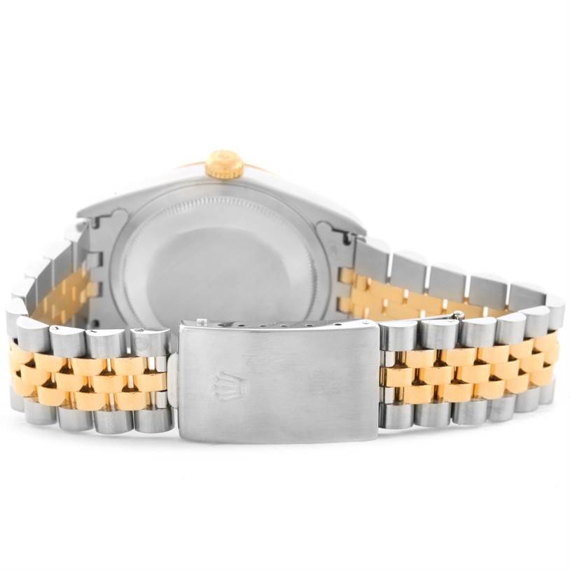 The image shows the back view of a Rolex Datejust 16233 Men's Steel and Gold (two tone) White Dial 16233 Men's Steel and Gold (two tone) White Dial watch with its clasp and Jubilee two-tone bracelet clearly visible.