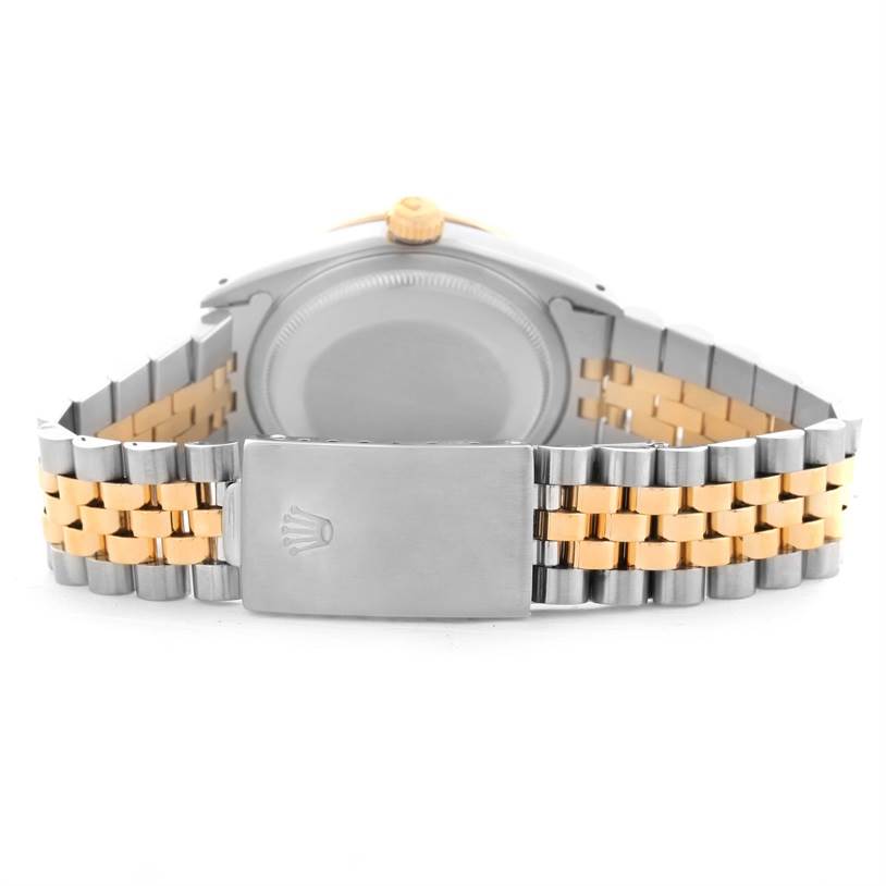 The image shows the back view of a Rolex Datejust 16233 Men
s Steel and Gold (two tone) Mother of Pearl Dial 16233 Men
s Steel and Gold (two tone) Mother of Pearl Dial watch, highlighting its case, crown, and two-tone bracelet with clasp.