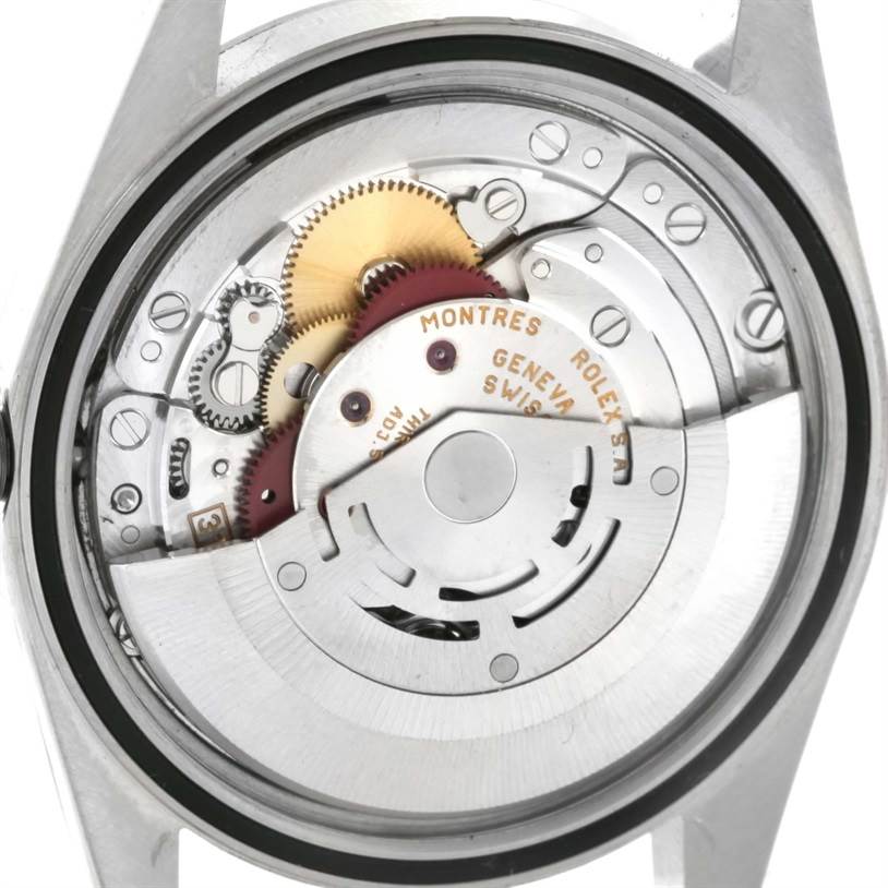 This image shows the back view of the internal mechanism of a Rolex Datejust 16234 Men
s Stainless Steel White Dial 16234 Men
s Stainless Steel White Dial watch, highlighting gears and components.