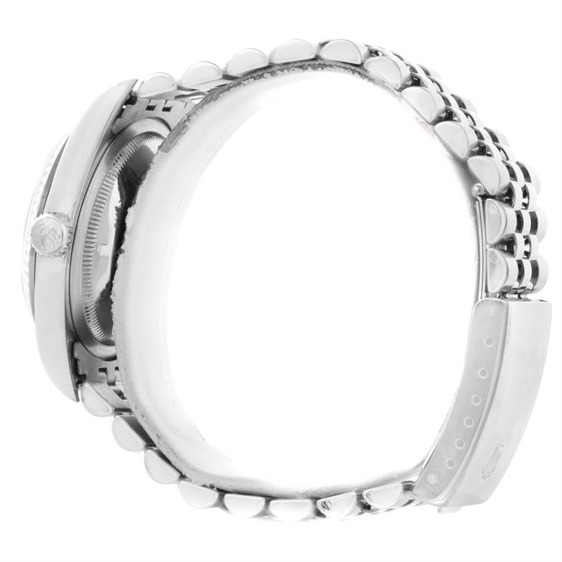 The image shows a side view of a Rolex Datejust 16234 Men
s Stainless Steel White Dial 16234 Men
s Stainless Steel White Dial watch, highlighting the case, crown, and bracelet.