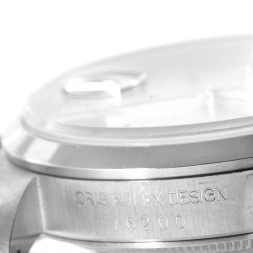 This image shows a close-up angle of the case side, bezel, and crystal of a Rolex Datejust 16200 Men's Stainless Steel Silver Dial 16200 Men's Stainless Steel Silver Dial model with "ORIG ROLEX DESIGN 16200" engraved.