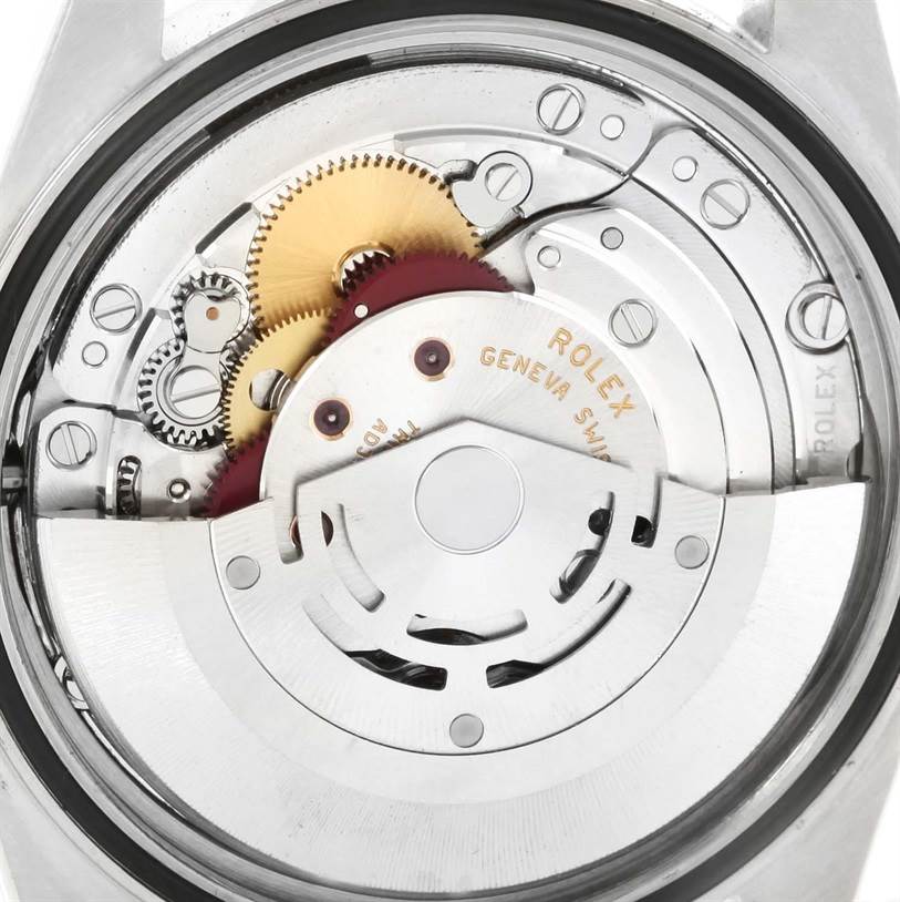 The image shows the internal movement mechanism of a Rolex Datejust 16200 Men's Stainless Steel Blue Dial 16200 Men's Stainless Steel Blue Dial watch with visible gears and components.