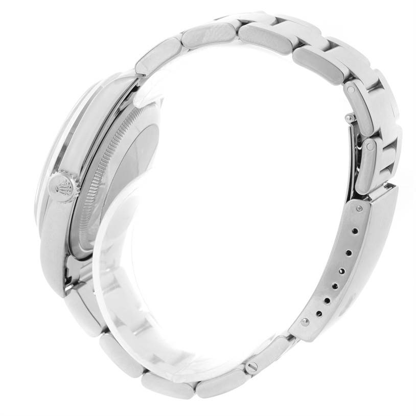 This side view of the Rolex Datejust 16200 Men's Stainless Steel Blue Dial 16200 Men's Stainless Steel Blue Dial watch showcases the case, crown, and linked bracelet.