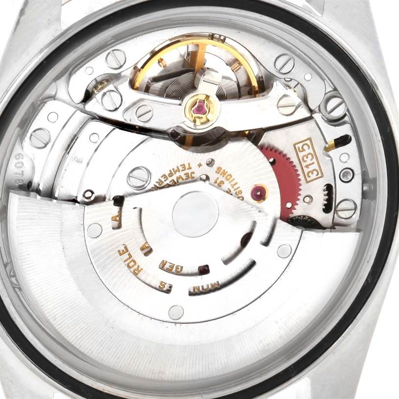 This image shows the movement mechanism of a Rolex Datejust 16233 Men's Steel and Gold (two tone) Black Dial 16233 Men's Steel and Gold (two tone) Black Dial watch viewed from the back.