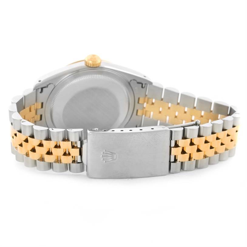 The image shows the back and clasp of a Rolex Datejust 16233 Men's Steel and Gold (two tone) Black Dial 16233 Men's Steel and Gold (two tone) Black Dial watch, featuring a two-tone bracelet.