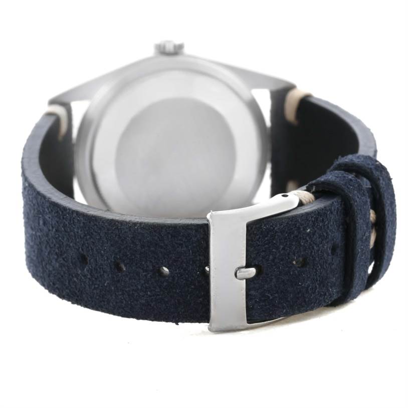 This image shows the back view of a Rolex Datejust 16200 Men's Stainless Steel Blue Dial 16200 Men's Stainless Steel Blue Dial watch with a blue suede strap and a silver buckle.