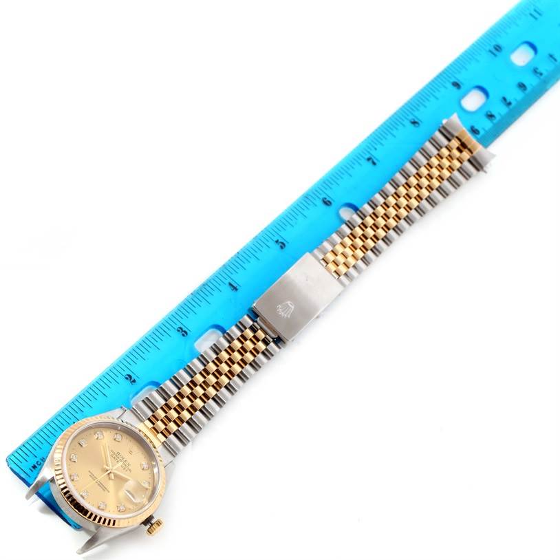 The image shows a top-down view of a Rolex Datejust 16233 Men's Steel and Gold (two tone) Champagne Dial 16233 Men's Steel and Gold (two tone) Champagne Dial watch, including the dial, bezel, bracelet, and folding clasp.